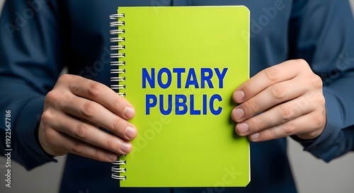 Professional Notary Public: Professional holding green notebook with notary public text, legal document certification, law office assistance, verification and trust concept
