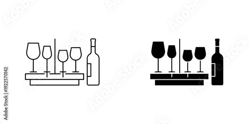 Elegant wine bottle and glasses set on minimalist black and white shelves for luxury dining and celebration