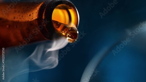 Refreshing Beer Poured From A Bottle Into A Glass At A Nightclub Or Moody Pub, Blue Background
