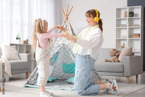 Nanny with little girl in h...