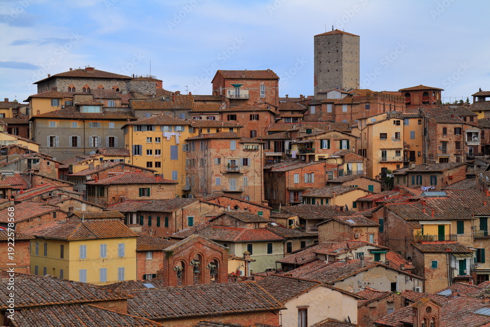 Fototapeta premium Siena, medieval town in Tuscany, with view of the Dome & Bell Tower of Siena Cathedral, Italy