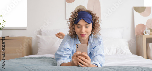 Young woman using mobile ph...