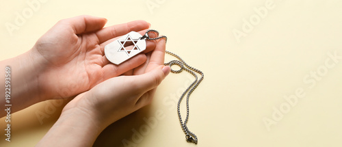 Hands with military tag of ...