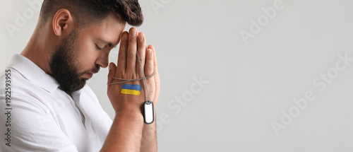 Young man with drawn flag o...