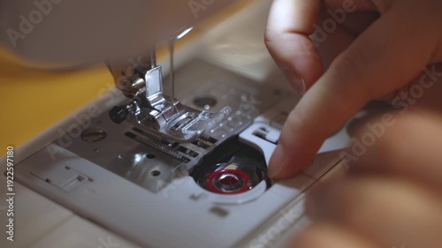 Sewing on a machine, close-up of needle and fabric