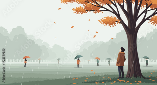 Man standing under a tree in autumn rain.