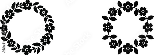 Black floral hoop earrings on white background