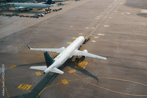 Aircraft departing international apron airport runway. Unknow airplane aerial view plane