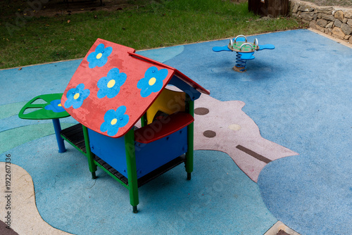 Colorful children playhouse on playground in city park