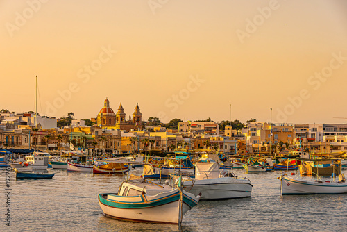 Boats in front of Marsaxlokk harbor, Malta.