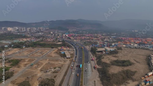 Aerial drone view of Atal Setu in Mumbai, India. The modern sea bridge stretches across the Arabian Sea, connecting the city to Navi Mumbai and showcasing large-scale infrastructure development, urban