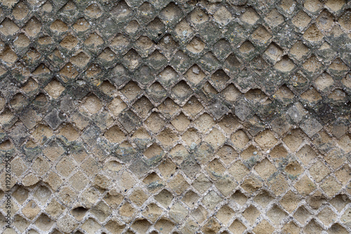 Ancient Roman opus reticulatum diamond pattern masonry wall detail in Pompeii Italy