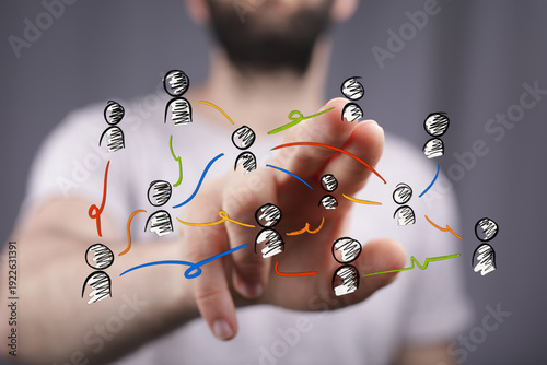 Hand pointing at a network ...