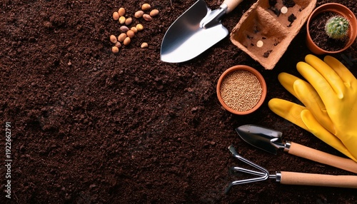 top view dark soil with gardening tools and seed for planting background