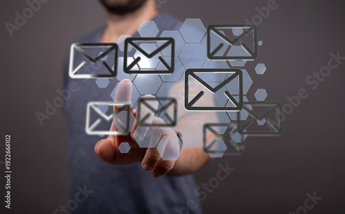 Obraz na plátně Concept of digital communication, with a hand interacting with email icons
