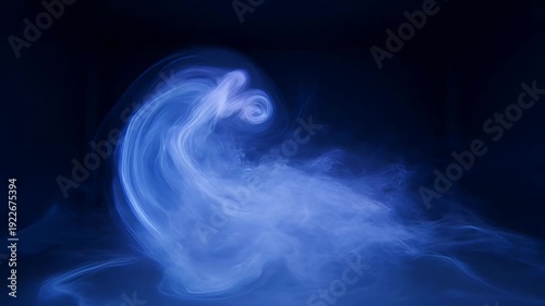 Swirling blue smoke forms a mesmerizing spiral on dark background - 4k video