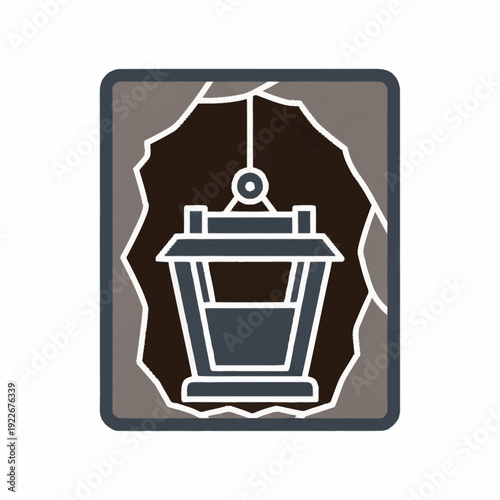 Mining bucket in a cave entrance, a symbol of resource extraction.