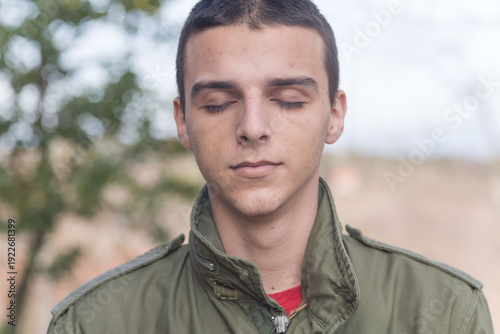 Young Man Meditating Indoors in Calm Minimalist Setting