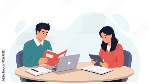 Students studying together, reading books and using tablet and laptop