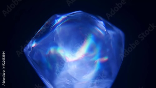 Stunning blue crystal reflecting light with rainbow hues - 4k video