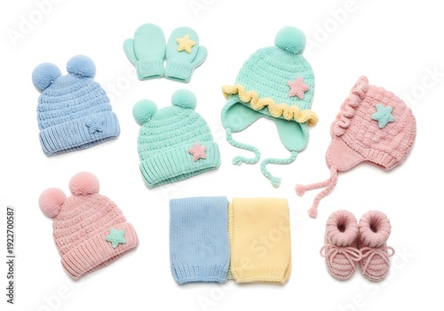 Knitted baby clothes set including hats, mittens, booties and scarf.