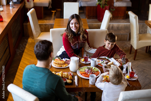 Family enjoys breakfast tog...