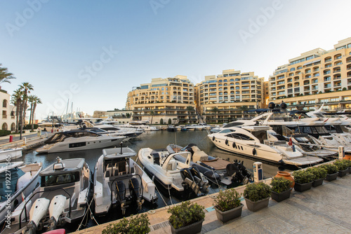 Luxury yachts at sunset in ...