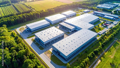 Aerial View of Modern Industrial Complex Surrounded by Green Fields