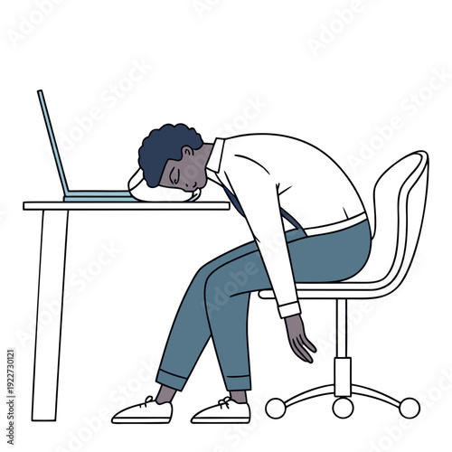 A man sitting at a desk looking tired