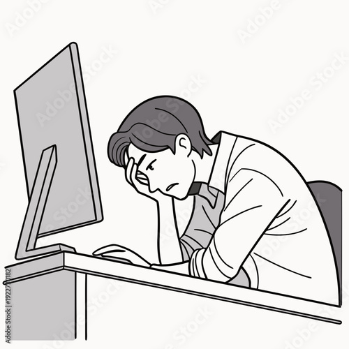 A woman is resting her head on her hand while sitting at a computer desk