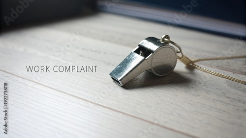 Silver Whistle Symbolizing Workplace Accountability and Reporting Issues