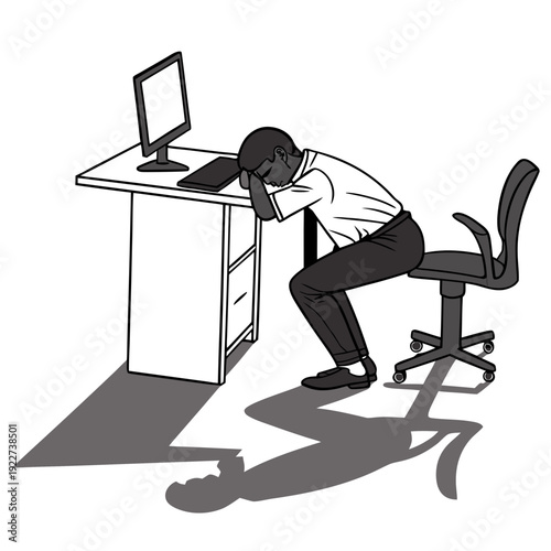 Man sitting at desk looking stressed and tired at work