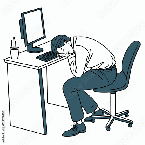 Man sitting at desk looking stressed and tired