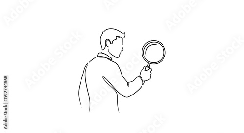 Man examining something closely with a magnifying glass.
