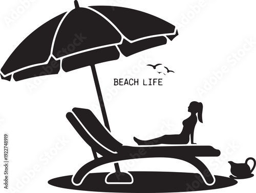 Relaxing under a beach umbrella with a cat and a book