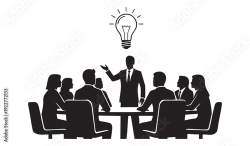 Meeting of business people gathered around a table with a speaker presenting a new idea, symbolized by a light bulb above