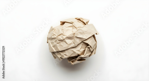 Crumpled paper ball on white background with soft shadow creative conceptual idea representation