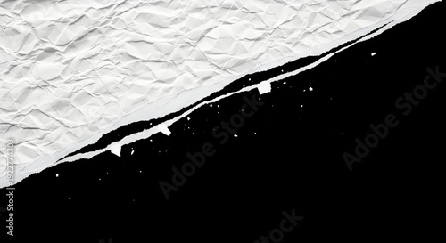 Crumpled white paper texture with torn edge isolated on contrasting black background design element