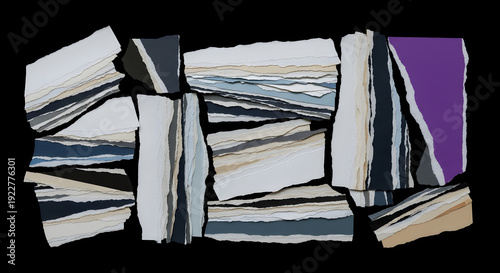 Layered paper art collage with mixed colors and abstract design on black background display