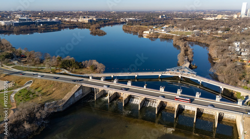 Drone aerial of Longhorn Dam along the Colorado River in East Austin, Texas. 