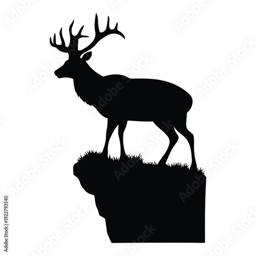 Black silhouette of a majestic stag standing on a grassy cliff edge deer animal