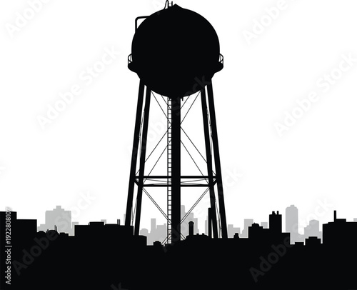The silhouette of an old industrial steel water tower stands tall against a blue sky, serving as a high metal storage reservoir and architecture building for the city water supply