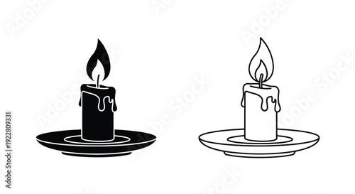 Two candles in monochrome one dark one light both on saucers