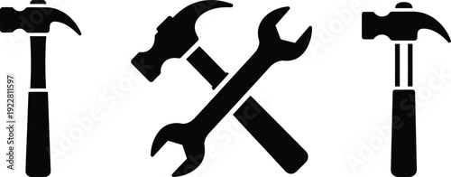 Silhouette of tools including a pickaxe hammer and wrench