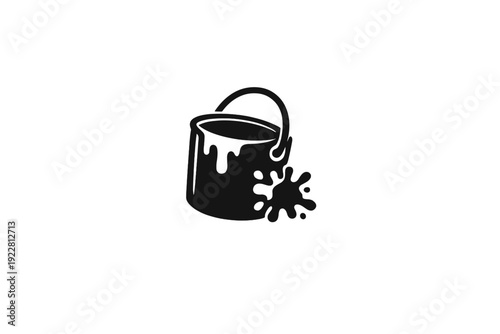 A black and white minimalist icon featuring a paint bucket with a handle and a paint splatter on the side. The design is simple and clean, set against a solid black background.
