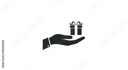 Hand holding two small gift boxes.