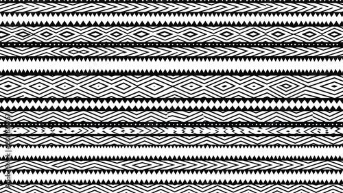 Complex black and white geometric tribal pattern with diamond shapes and zigzag lines for traditional ethnic textile and decor themes.