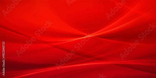A flowing red silk and satin fabric background featuring smooth waves and soft light textures for an elegant textile wallpaper design