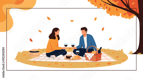 Young couple enjoying a romantic picnic on a blanket under a tree with orange leaves during the autumn season.