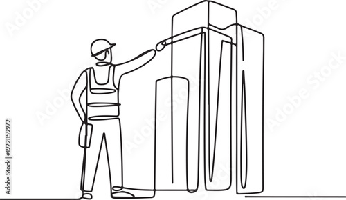 Man in uniform standing beside large industrial machinery, inspecting equipment in a factory setting from a side view